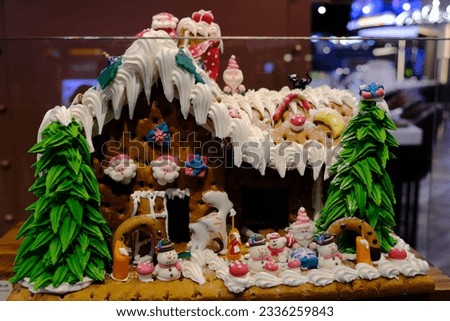 Cakes decorated with chocolates in the shape of a house