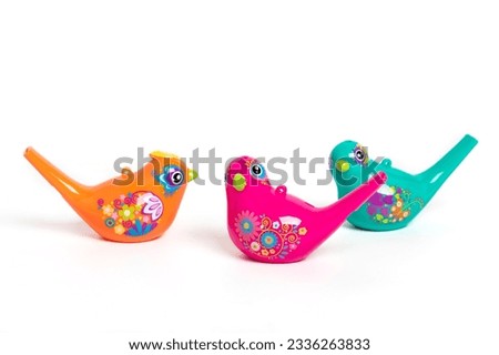 Bird whistle, children's toy isolated on white background Entertainment for children