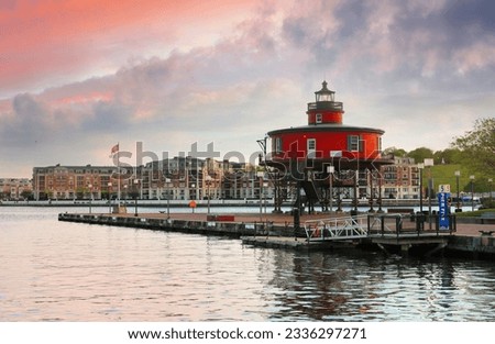 Seven Foot Knoll Lighthouse in Baltimore’s Inner Harbor at sunset, . This famous screwpile style lighthouse once stood watch atop Seven Foot Knoll in the Chesapeake Bay, Baltimore Maryland