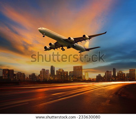 traffic light in land transportation and passenger airplane flying above urban scene use for transport business and  traveling theme Royalty-Free Stock Photo #233630080