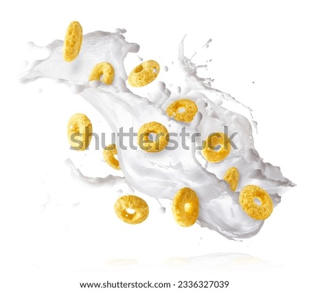Tasty ring cereals with milk splashes falling in the air isolated. Food levitation conception. High ewsolution image Royalty-Free Stock Photo #2336327039