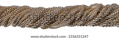 Large Stringed twisted strands of pearls Royalty-Free Stock Photo #2336331247