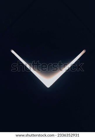 V shape lighting in the darkness Royalty-Free Stock Photo #2336352931