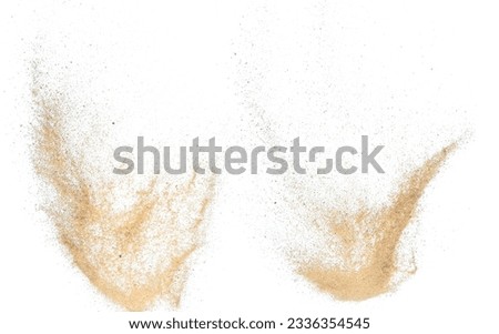 Sand flying explosion, Golden sand wave explode. Abstract sands cloud fly. Yellow colored sand splash throwing in Air. White background Isolated high speed shutter, throwing freeze stop motion Royalty-Free Stock Photo #2336354545