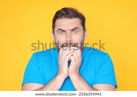 Studio isolated portrait of middle aged man with surprise facial expression. Man Hispanic man worried and nervous, concerned and surprised expression. Fear and excited male face. Amazement concept. Royalty-Free Stock Photo #2336354941