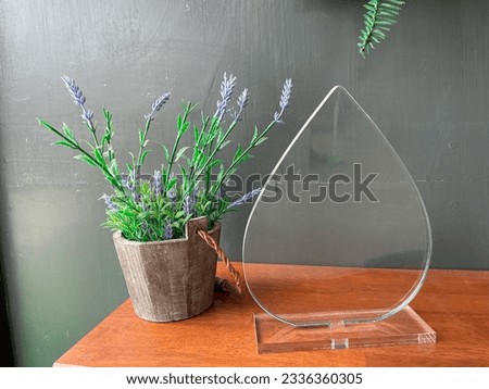 A wooden pot and a clear acrylic frame sign, For home, interior and living room decoration.