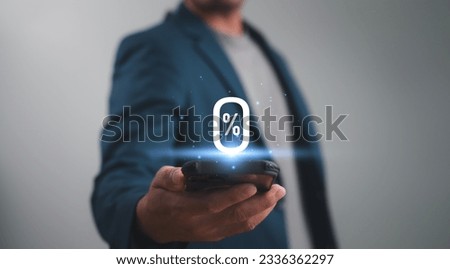 Businessman showing glowing zero percentage or 0 percent for special offer of shopping department store and discount concept. Interest rate, installment payment, promotion, marketing, boost sales