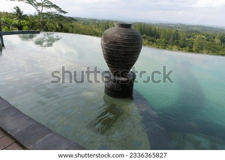 swimming pool on the mountain with a beautiful concept of nature and classic architecture, with a backdrop of green forest scenery