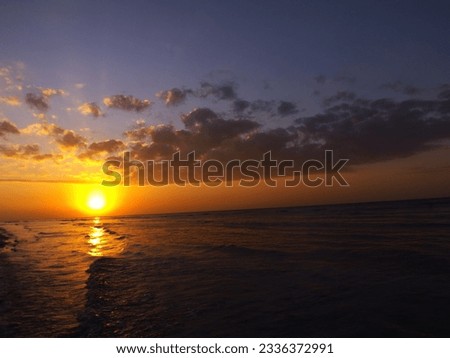 the sun rises over the sea, a beautiful moment to be enjoyed