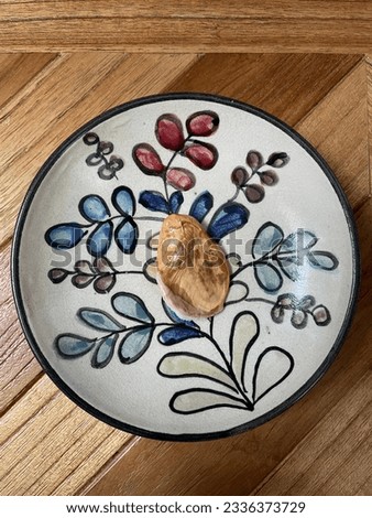 Musang king durian seed on bohemian plate with wooden background