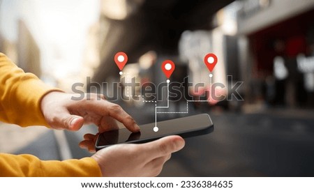 Male hand using smartphone GPS navigator. Discovering new destinations. Navigate the streets and explore cityscapes with modern technology, join the digital revolution of travel. Royalty-Free Stock Photo #2336384635