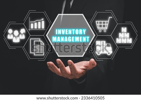 Inventory management concept, Businessman hand holding inventory management icon on virtual screen.