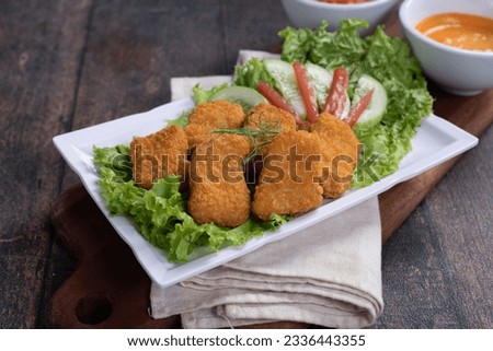 Fried crispy chicken nuggets with chili sauce, food photography