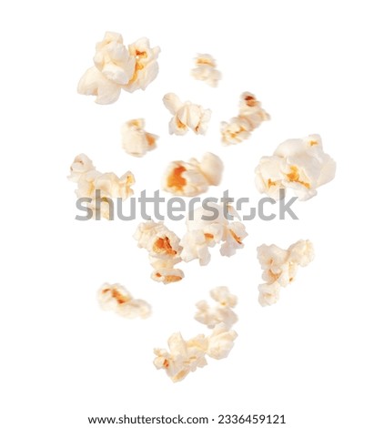 Fluffy popcorn scattered in the air closeup isolated on white background Royalty-Free Stock Photo #2336459121