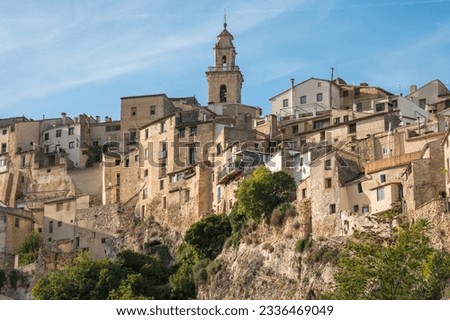 Panoramic image view to Bocairent village against rocky mountains and clear blue sky background. Comarca of Vall d`Albaida in Valencian Community, Spain