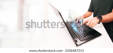 Businessman analyzing investment charts with laptop computer. panoramic banner with copy space
