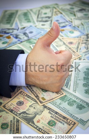 American dollars and OK sign hand. Business