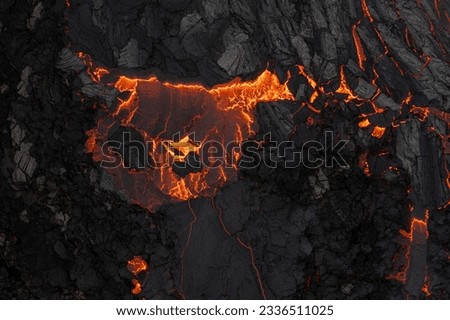 Aerial view of the texture of a solidifying lava field, close-up Royalty-Free Stock Photo #2336511025