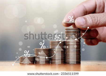 interest rate concept Business growth. Profit. Hand placing coin upward gradient with percent symbol. Royalty-Free Stock Photo #2336511599