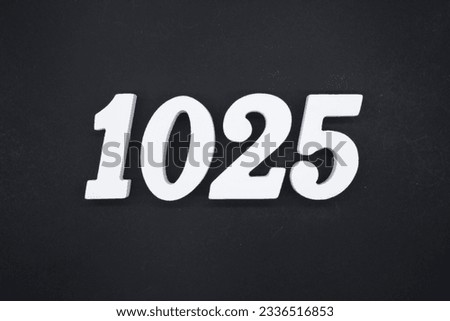 Black for the background. The number 1025 is made of white painted wood.