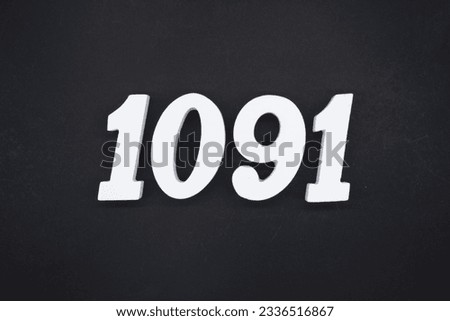 Black for the background. The number 1091 is made of white painted wood.