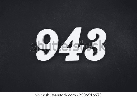 Black for the background. The number 943 is made of white painted wood.