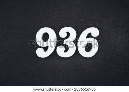 Black for the background. The number 936 is made of white painted wood.