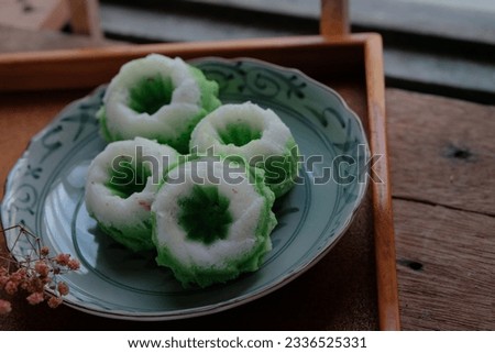 Malaysian's traditional food, Kuih Seri Ayu or Kuih Puteri Ayu. Pretty in green and white, these coconut-scented sponge cakes are a real treat for all occasions.