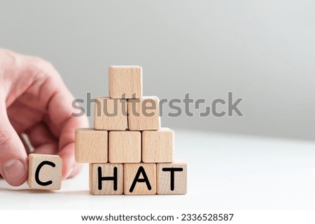 Chat written in wooden cubes on a desk