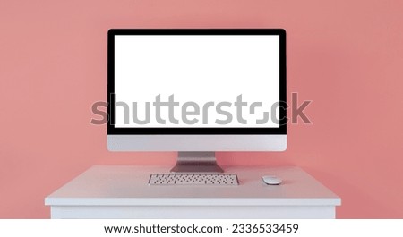 Mockup of a monitor with a white screen, with a keyboard on a table on a pink background.  Computer freelancer designer and marketer, template for online courses.