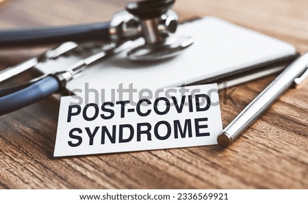 Post-covid syndrome symbol. White card with inscription. Medical and post-covid syndrome concept. Copy space. Royalty-Free Stock Photo #2336569921