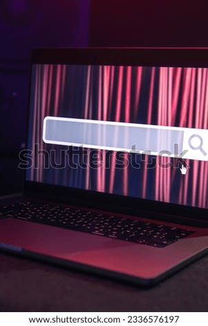 Laptop with internet browser search bar on screen.