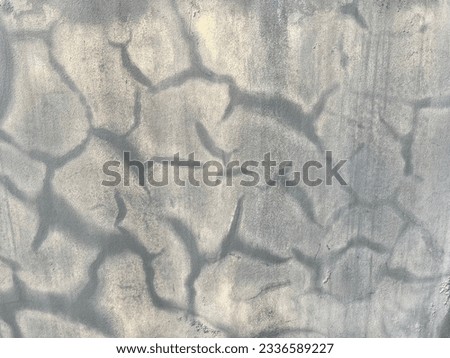 Watermark traces from rainwater stains.cracked cement floor
