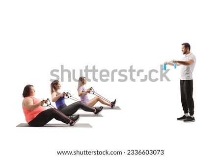 Male trainer and women exercising with a resistance bands isolated on white background