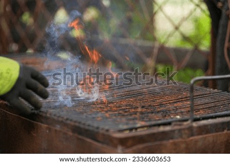 barbeque. flames coming out of a barbecue grate.
