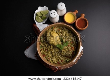 Arroz con pollo chicken with green rice Food buffet peruvian table Assorted dishes gourmet cuisine Peru traditional  Royalty-Free Stock Photo #2336615147