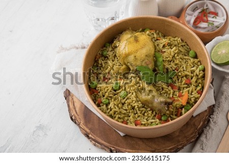 Arroz con pollo chicken with green rice Food buffet peruvian table Assorted dishes gourmet cuisine Peru traditional  Royalty-Free Stock Photo #2336615175