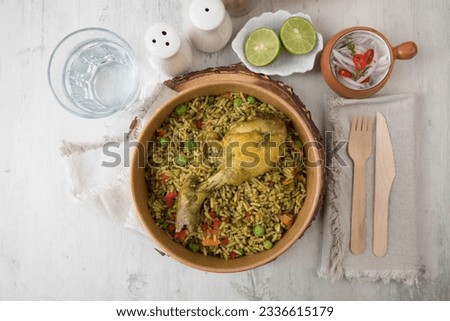 Arroz con pollo chicken with green rice Food buffet peruvian table Assorted dishes gourmet cuisine Peru traditional  Royalty-Free Stock Photo #2336615179
