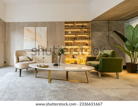 modern interior design of the living area in the studio apartment in warm soft colors. decorative built-in lighting and soft beige furniture Royalty-Free Stock Photo #2336631667