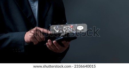 Hand holding smartphone with touchscreen checking email icon online communication, social media concept.