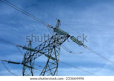 high voltage tower with a sky background