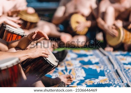 People having fun playing with their hands in a drum circle on djembe Royalty-Free Stock Photo #2336646469
