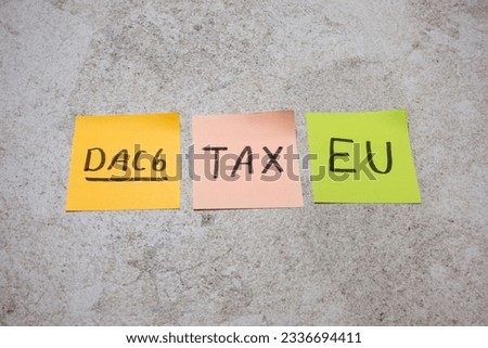 DAC6 (DAC 6), written on sticky note for EU directive on cross-border tax arrangements for information exchange to prevent tax evasion and enhance transparency