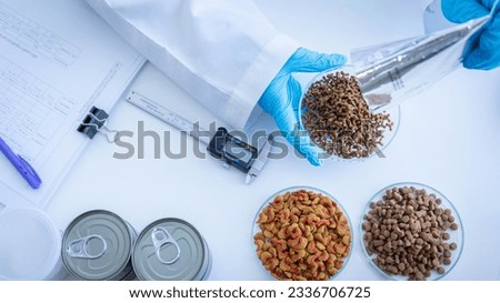 Close up picture of quality control personnel are inspecting the quality of canned pet food. Physical quality inspection. Quality control process of pet food industry.	