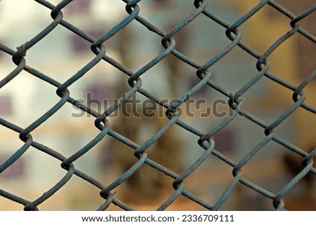 barbed wire is a symbol of both beauty and hardship. Its sharp, twisted strands have been used for centuries to mark boundaries and protect precious resources. Royalty-Free Stock Photo #2336709111