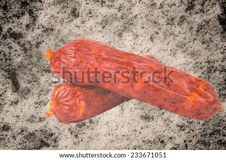 two smoked sausage isolated on white background