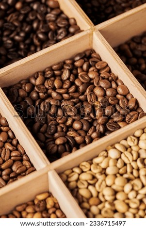 coffee beans in wooden box, different roast, caffeine and energy, espresso, coffee background Royalty-Free Stock Photo #2336715497