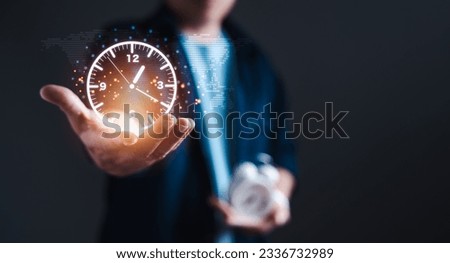 Time management, finance, planning, and strategy, Through the virtual icons, the businessman harnesses the potential of cutting-edge digital solutions to optimize his performance and drive success Royalty-Free Stock Photo #2336732989
