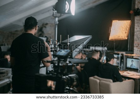 Film set, monitors and modern shooting equipment. Film crew, lighting devices, monitors, playbacks - filming equipment and a team of specialists in filming movies, advertising and TV series Royalty-Free Stock Photo #2336733385