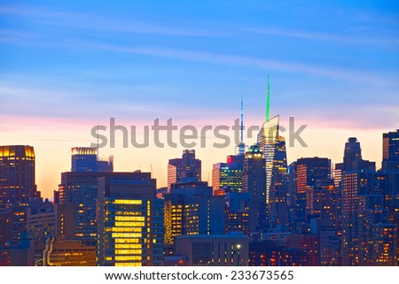 New York City, USA. detail of Downtown buildings in Manhattan with colorful lights, panorama at sunset  